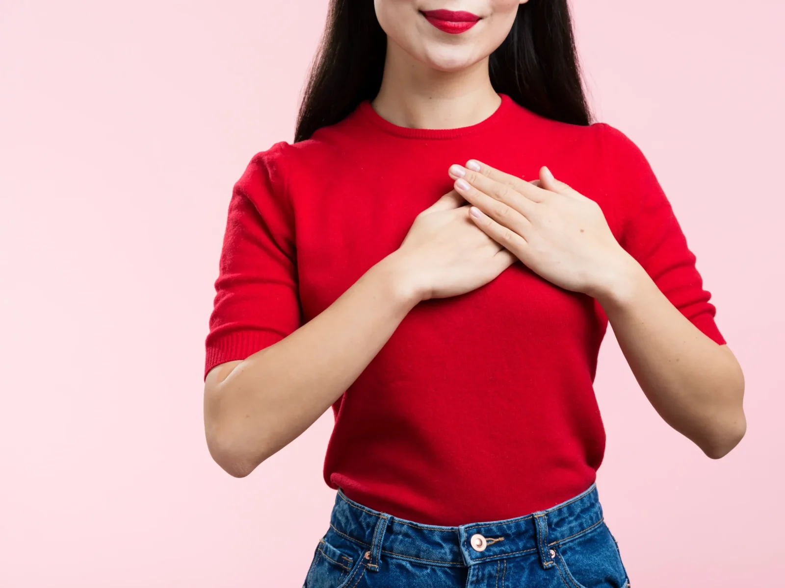 close-up-woman-with-red-lips-with-hand-heart